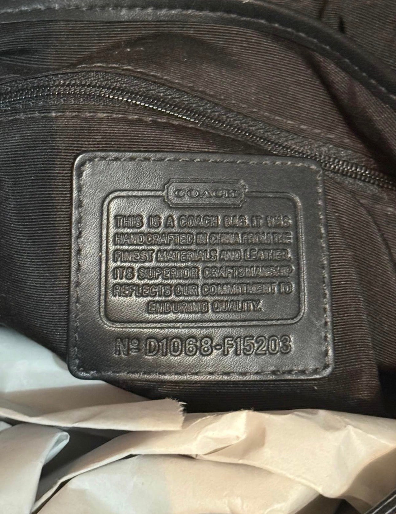 Black and grey coach shoulder bag with adjustable strap